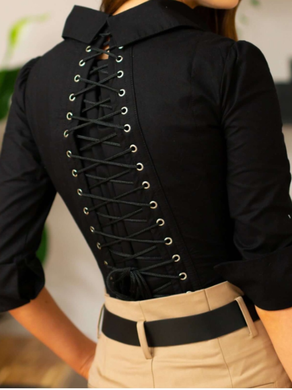 Corset Story black corset blouse featuring front metal busk closures